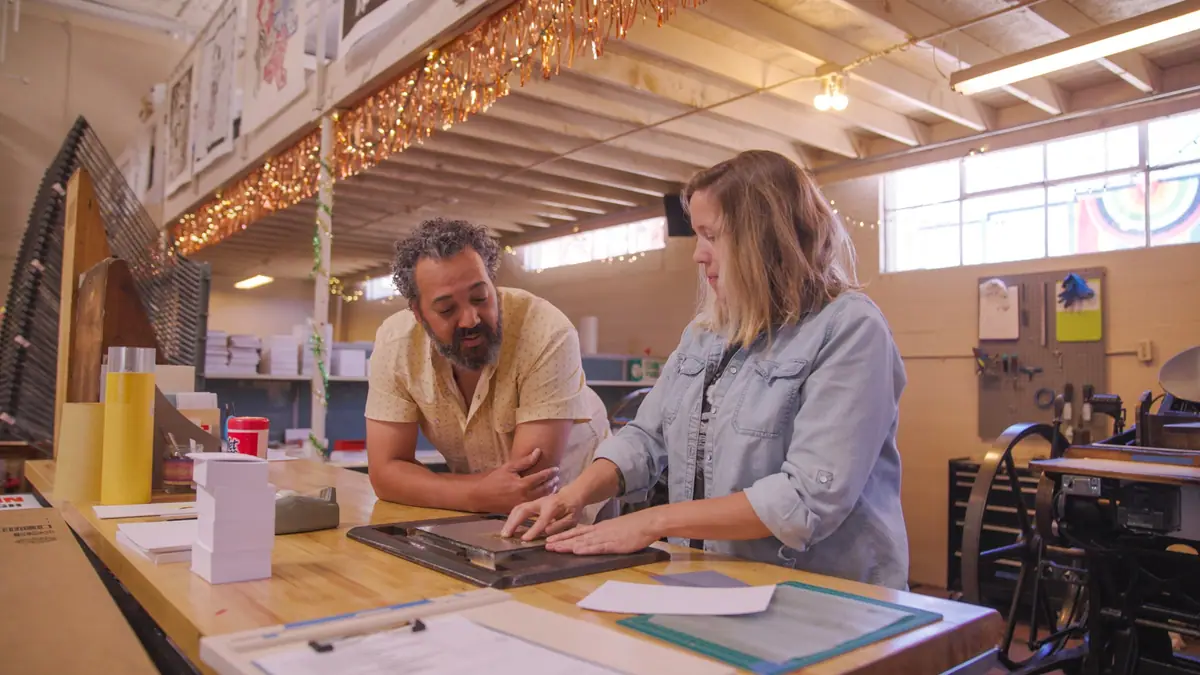 Josh Crumpton at work in a letterpress shop while filming No Small Water