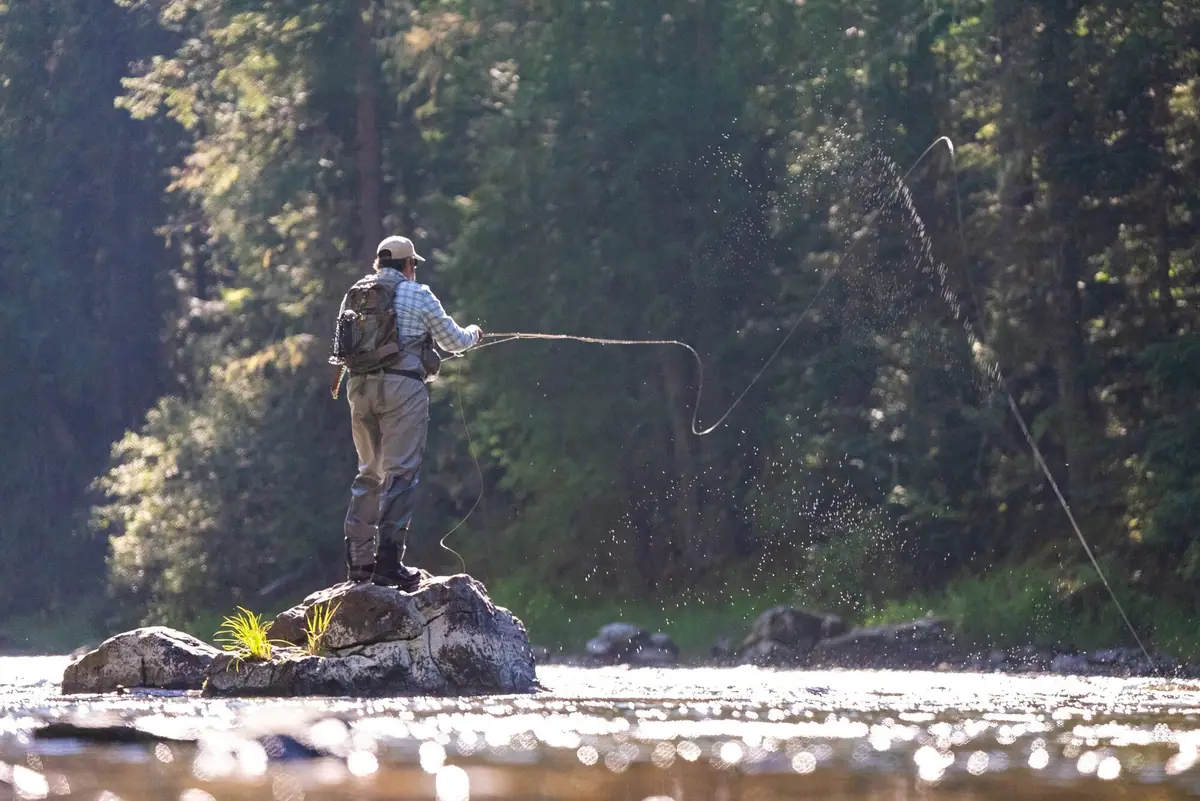 Josh Crumpton fly casting on a mountain river